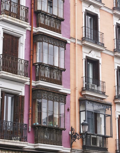 Antique building classic colored facades in Madrid city center. Spain
